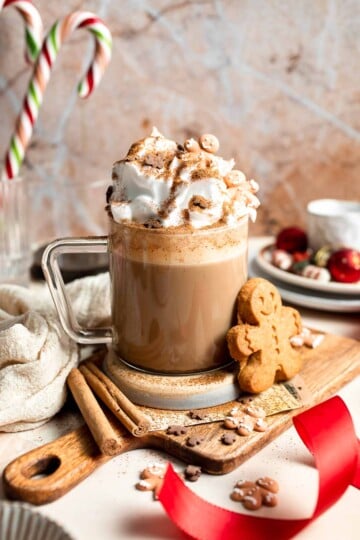 Cozy homemade gingerbread latte recipe made with homemade gingerbread syrup, espresso, warm spices, and steamed milk. | aheadofthyme.com