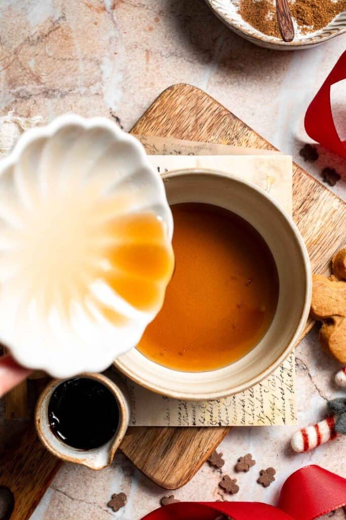 Cozy homemade gingerbread latte recipe made with homemade gingerbread syrup, espresso, warm spices, and steamed milk. | aheadofthyme.com