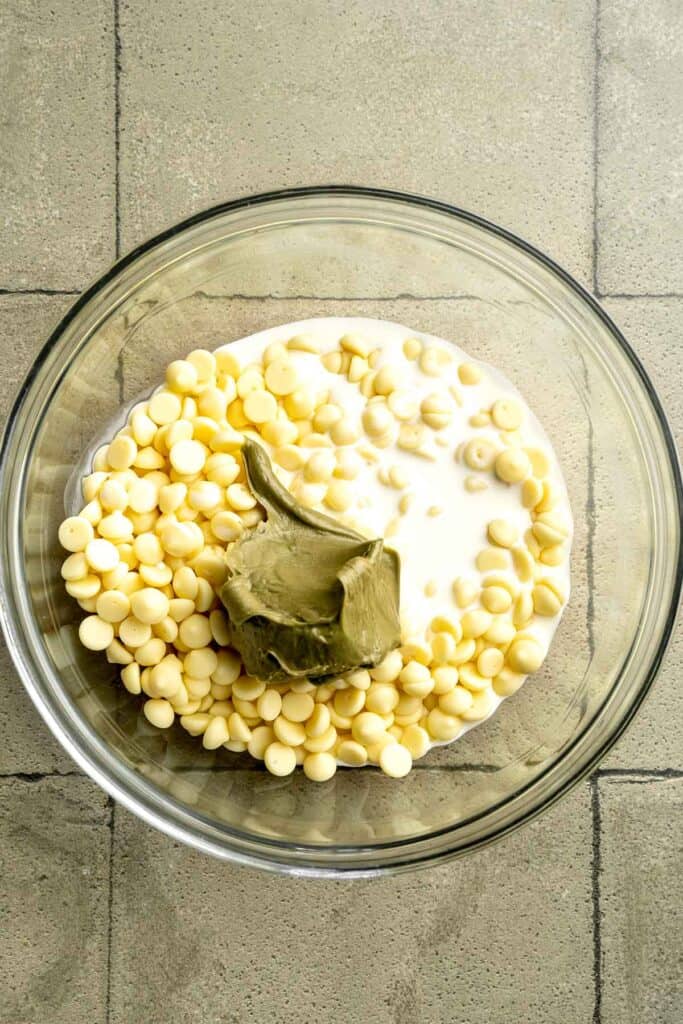 Buttery pistachio thumbprint cookies filled with pistachio white chocolate ganache that bake into elegant, nutty treats perfect for gifting or any occasion. | aheadofthyme.com