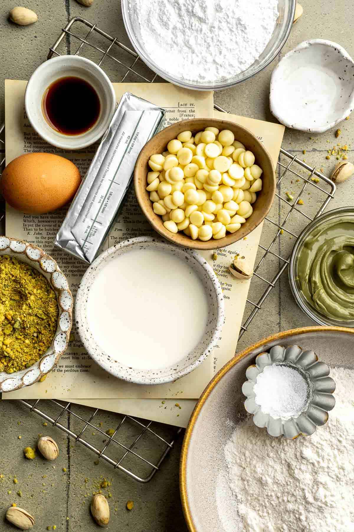 Buttery pistachio thumbprint cookies filled with pistachio white chocolate ganache that bake into elegant, nutty treats perfect for gifting or any occasion. | aheadofthyme.com