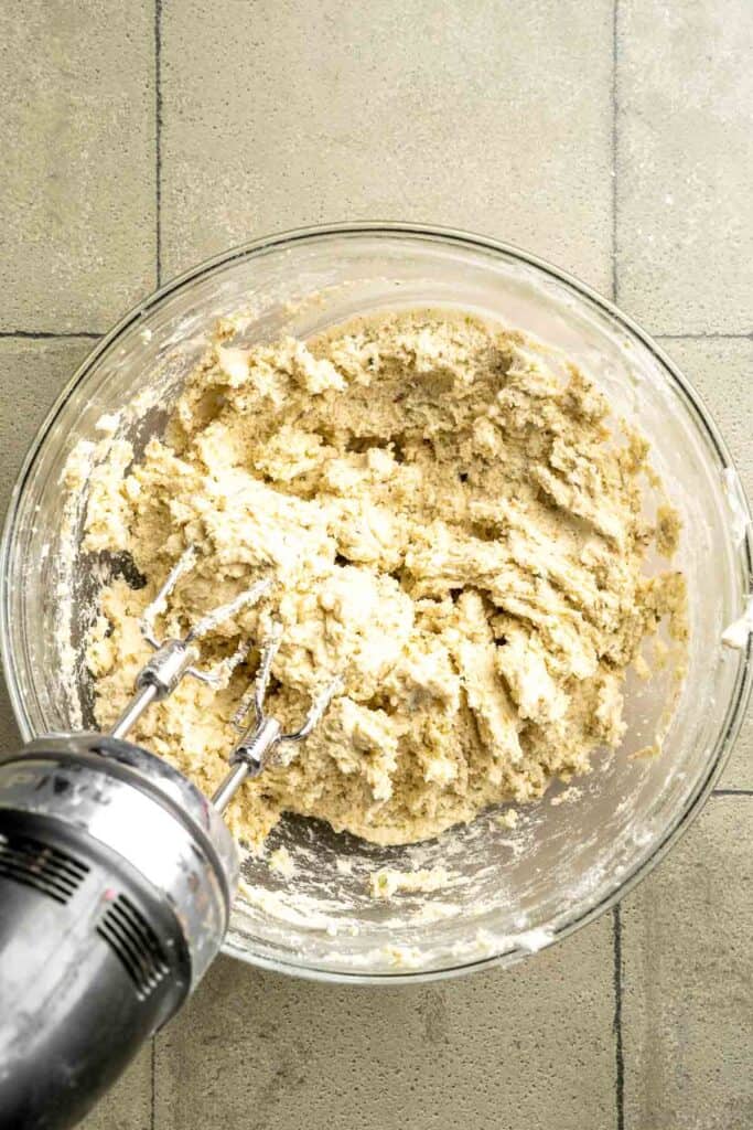 Buttery pistachio thumbprint cookies filled with pistachio white chocolate ganache that bake into elegant, nutty treats perfect for gifting or any occasion. | aheadofthyme.com