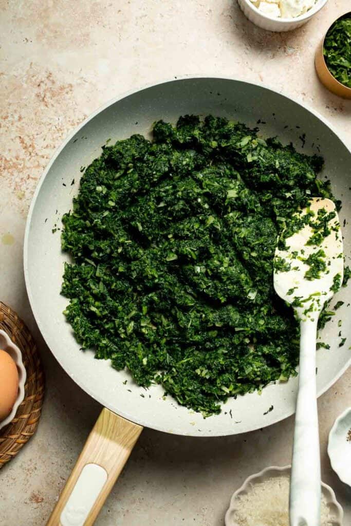 Flaky spinach puff pastry bites filled with sautéed spinach, feta, and parmesan. An easy, crowd pleasing appetizer for any occasion. | aheadofthyme.com