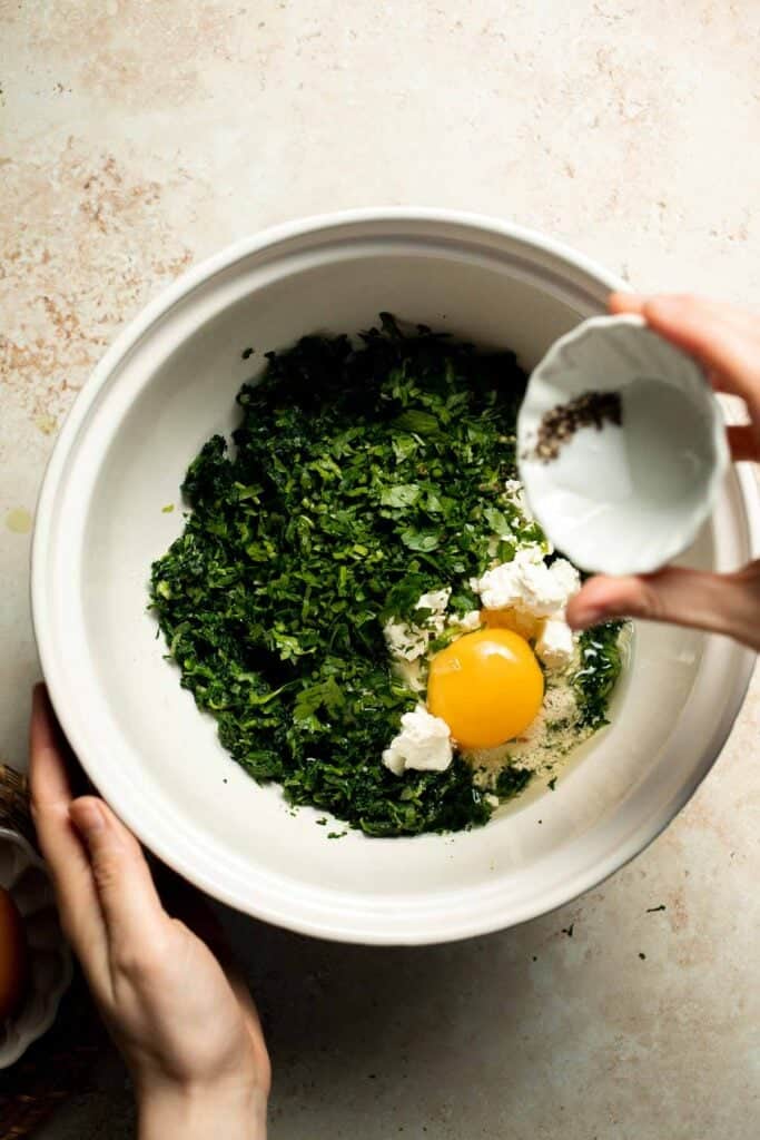Flaky spinach puff pastry bites filled with sautéed spinach, feta, and parmesan. An easy, crowd pleasing appetizer for any occasion. | aheadofthyme.com