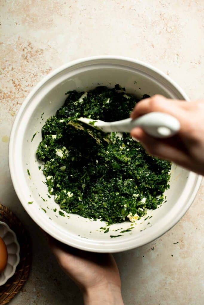 Flaky spinach puff pastry bites filled with sautéed spinach, feta, and parmesan. An easy, crowd pleasing appetizer for any occasion. | aheadofthyme.com