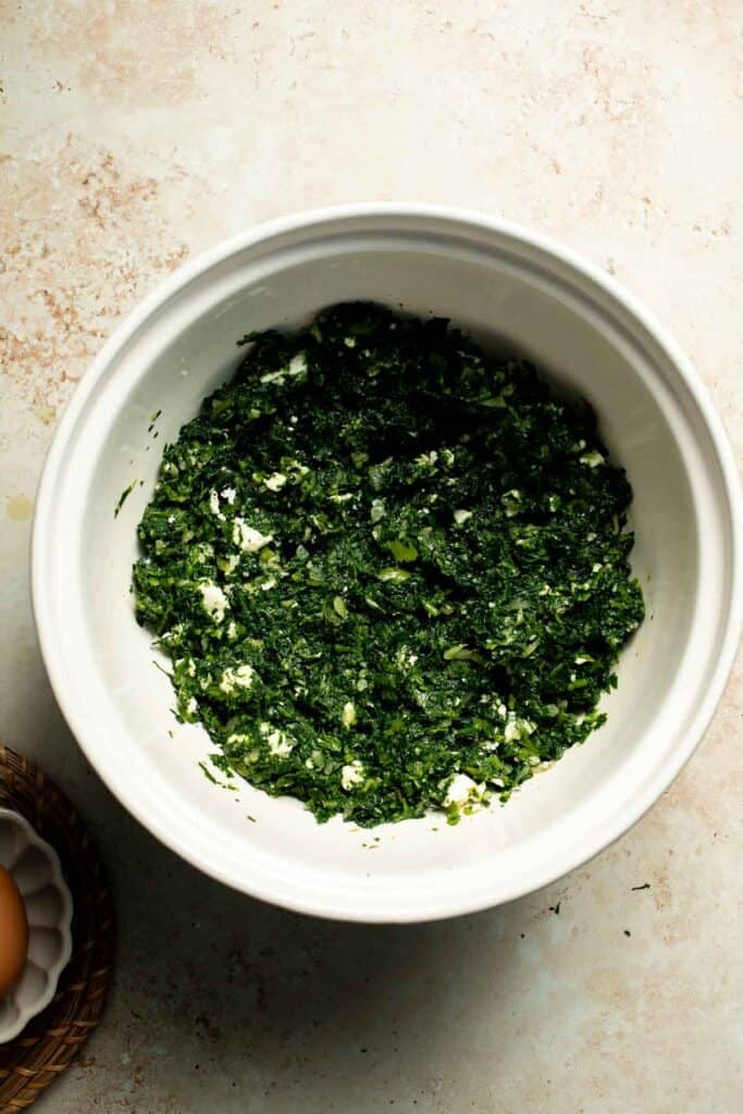 Flaky spinach puff pastry bites filled with sautéed spinach, feta, and parmesan. An easy, crowd pleasing appetizer for any occasion. | aheadofthyme.com