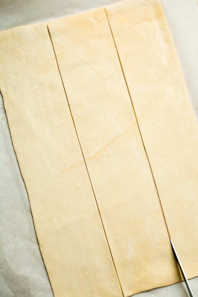 Flaky spinach puff pastry bites filled with sautéed spinach, feta, and parmesan. An easy, crowd pleasing appetizer for any occasion. | aheadofthyme.com