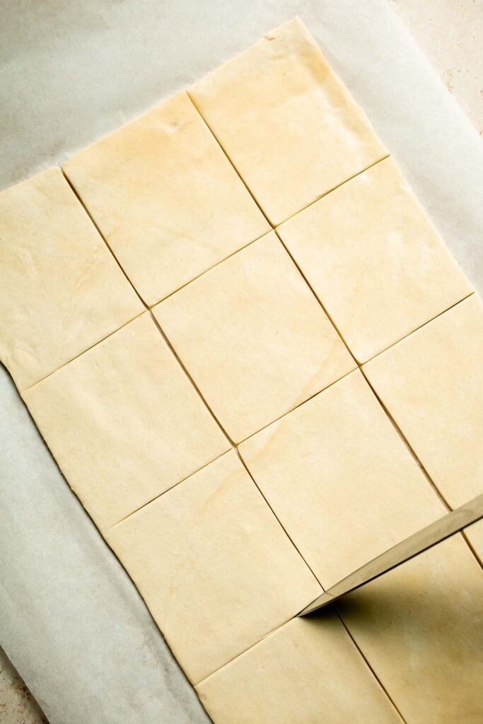 Flaky spinach puff pastry bites filled with sautéed spinach, feta, and parmesan. An easy, crowd pleasing appetizer for any occasion. | aheadofthyme.com