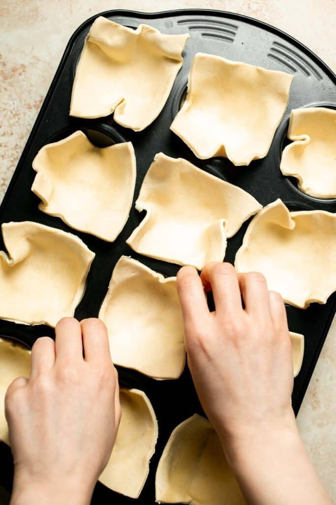 Flaky spinach puff pastry bites filled with sautéed spinach, feta, and parmesan. An easy, crowd pleasing appetizer for any occasion. | aheadofthyme.com