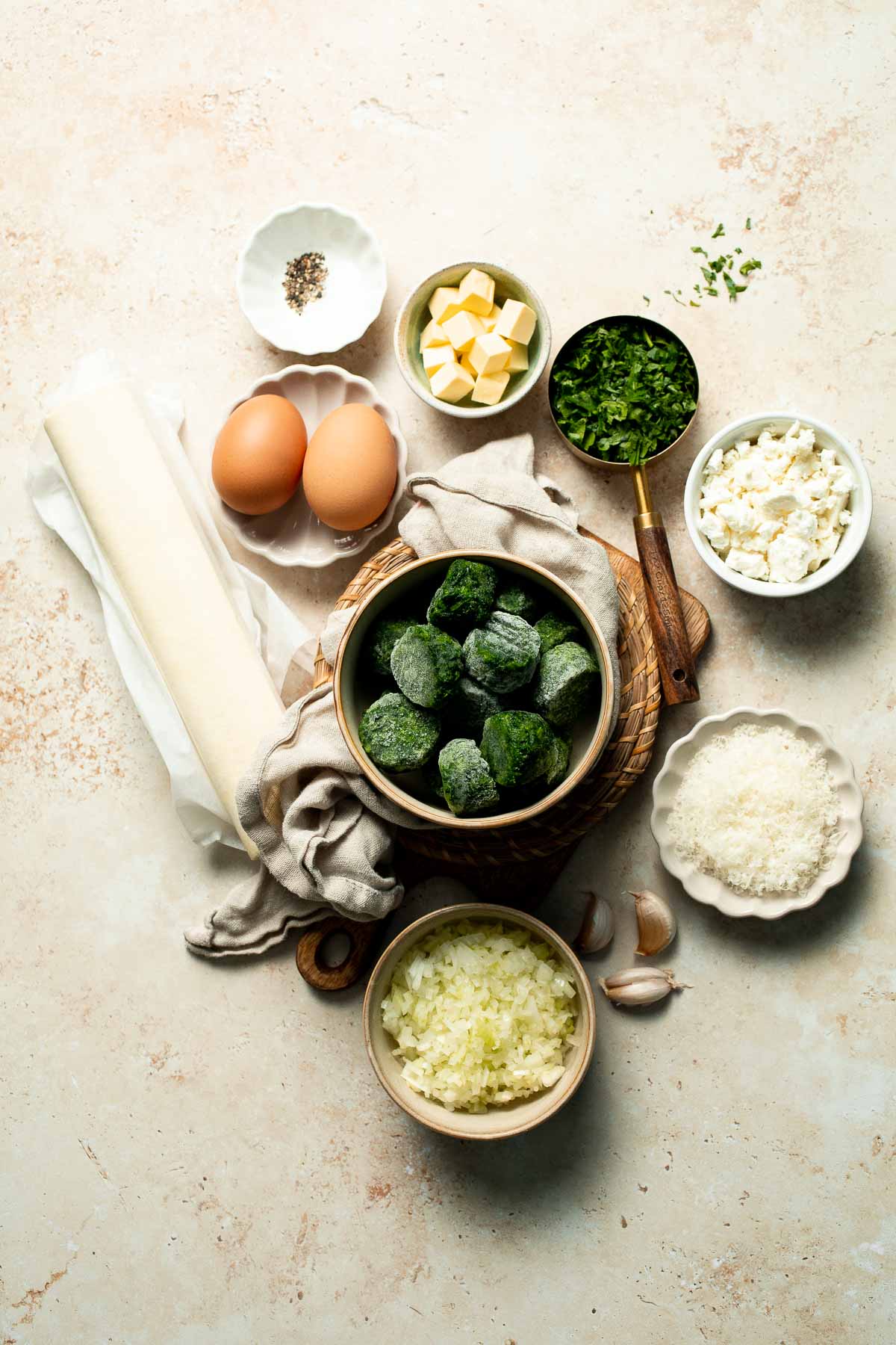 Flaky spinach puff pastry bites filled with sautéed spinach, feta, and parmesan. An easy, crowd pleasing appetizer for any occasion. | aheadofthyme.com
