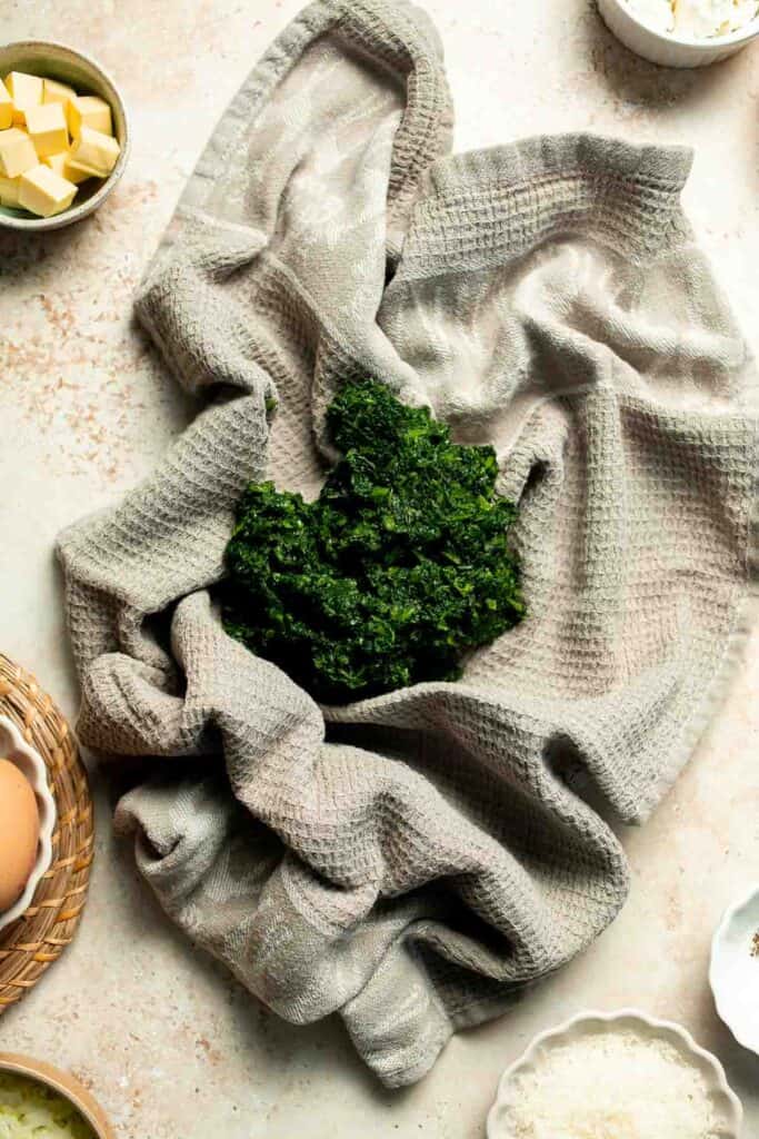 Flaky spinach puff pastry bites filled with sautéed spinach, feta, and parmesan. An easy, crowd pleasing appetizer for any occasion. | aheadofthyme.com