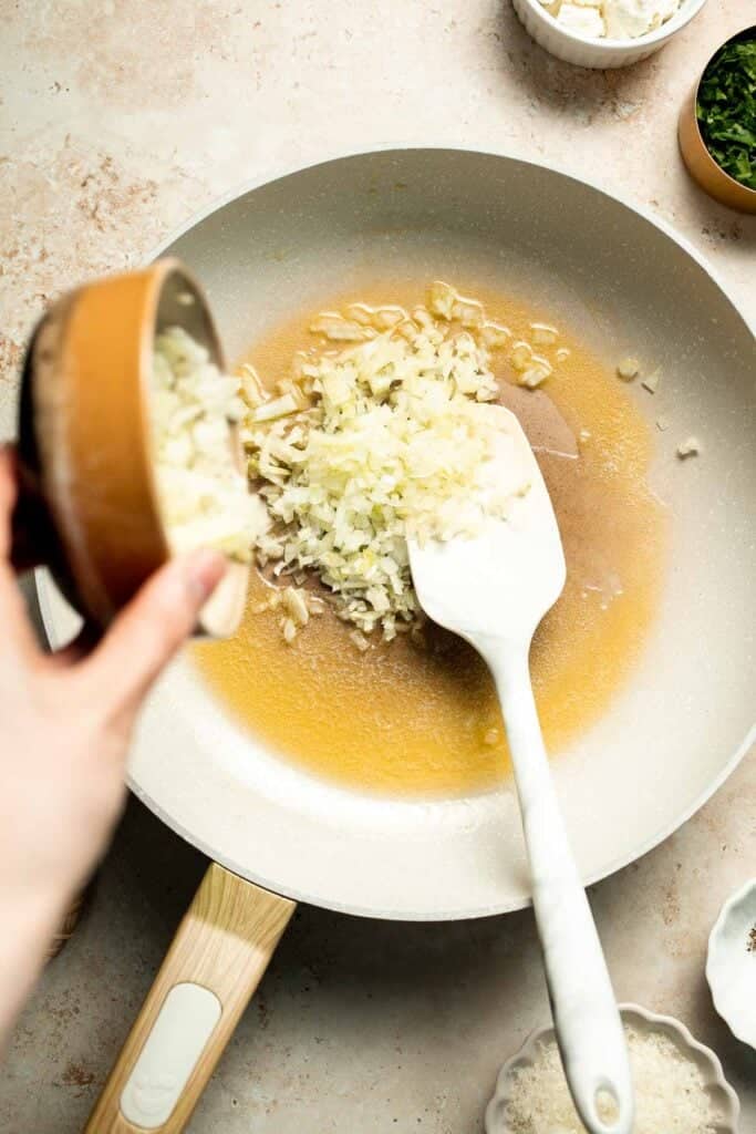 Flaky spinach puff pastry bites filled with sautéed spinach, feta, and parmesan. An easy, crowd pleasing appetizer for any occasion. | aheadofthyme.com