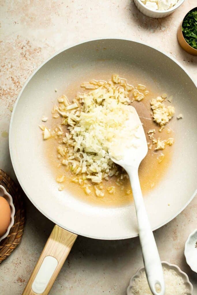 Flaky spinach puff pastry bites filled with sautéed spinach, feta, and parmesan. An easy, crowd pleasing appetizer for any occasion. | aheadofthyme.com