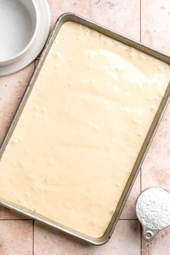 Light and fluffy vanilla Swiss roll cake filled with whipped cream, made with a soft sponge that rolls beautifully every time. | aheadofthyme.com