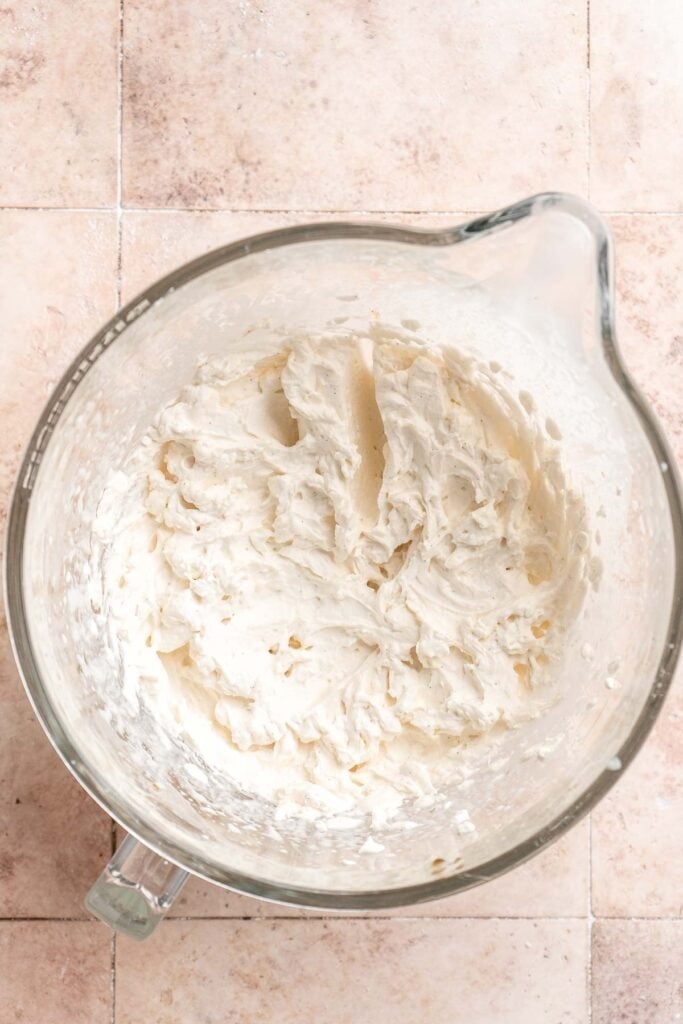 Light and fluffy vanilla Swiss roll cake filled with whipped cream, made with a soft sponge that rolls beautifully every time. | aheadofthyme.com