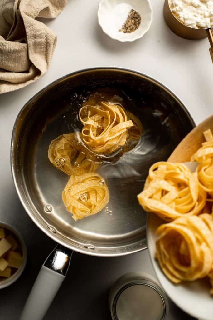 Creamy cottage cheese alfredo pasta made with simple ingredients, high protein, lighter than traditional alfredo, and ready in 20 minutes. | aheadofthyme.com