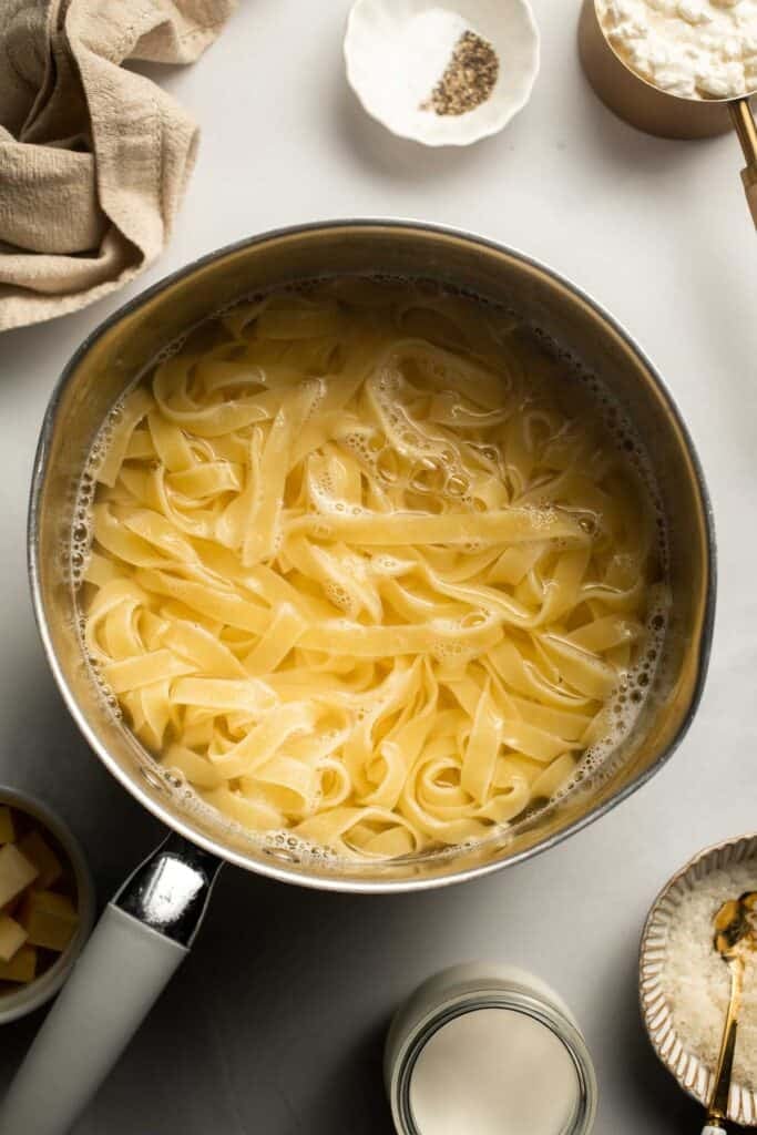 Creamy cottage cheese alfredo pasta made with simple ingredients, high protein, lighter than traditional alfredo, and ready in 20 minutes. | aheadofthyme.com