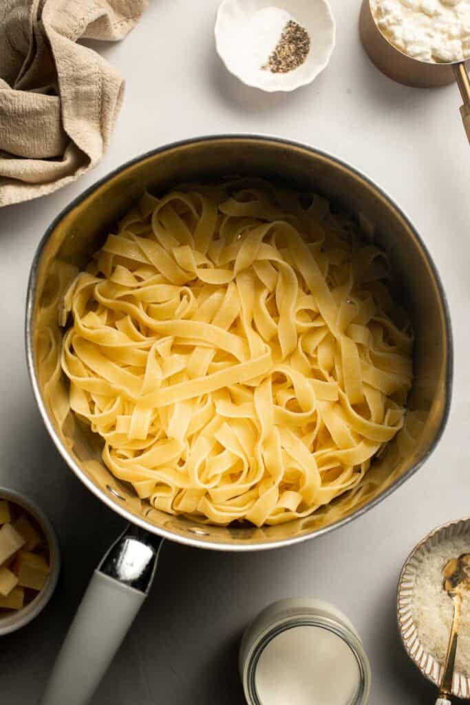 Creamy cottage cheese alfredo pasta made with simple ingredients, high protein, lighter than traditional alfredo, and ready in 20 minutes. | aheadofthyme.com