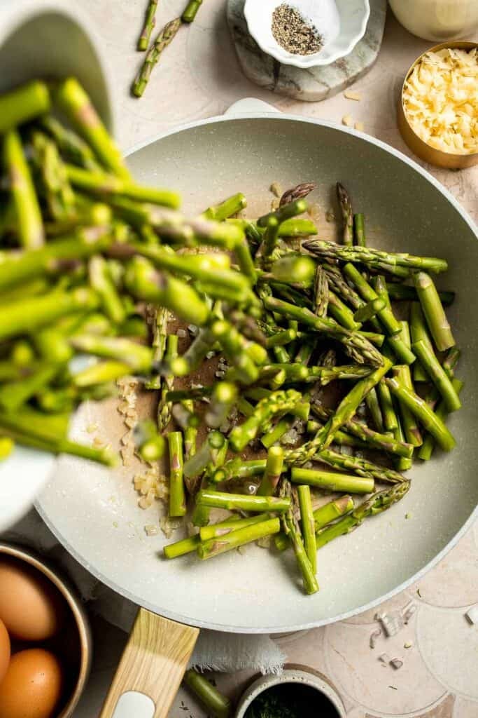 Creamy asparagus quiche with Gruyère cheese, flaky crust, and fresh dill, perfect for spring brunch, meal prep, or light dinner. | aheadofthyme.com
