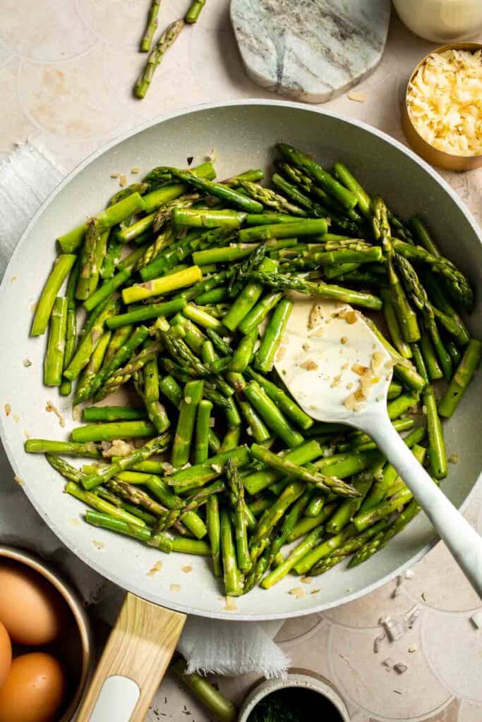 Creamy asparagus quiche with Gruyère cheese, flaky crust, and fresh dill, perfect for spring brunch, meal prep, or light dinner. | aheadofthyme.com