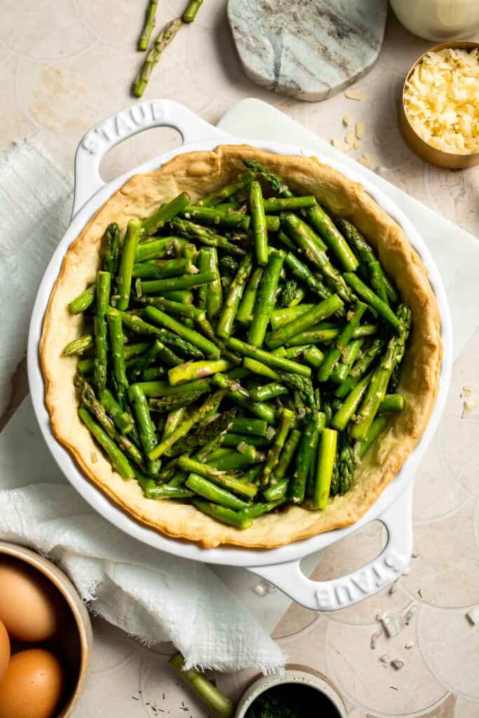 Creamy asparagus quiche with Gruyère cheese, flaky crust, and fresh dill, perfect for spring brunch, meal prep, or light dinner. | aheadofthyme.com