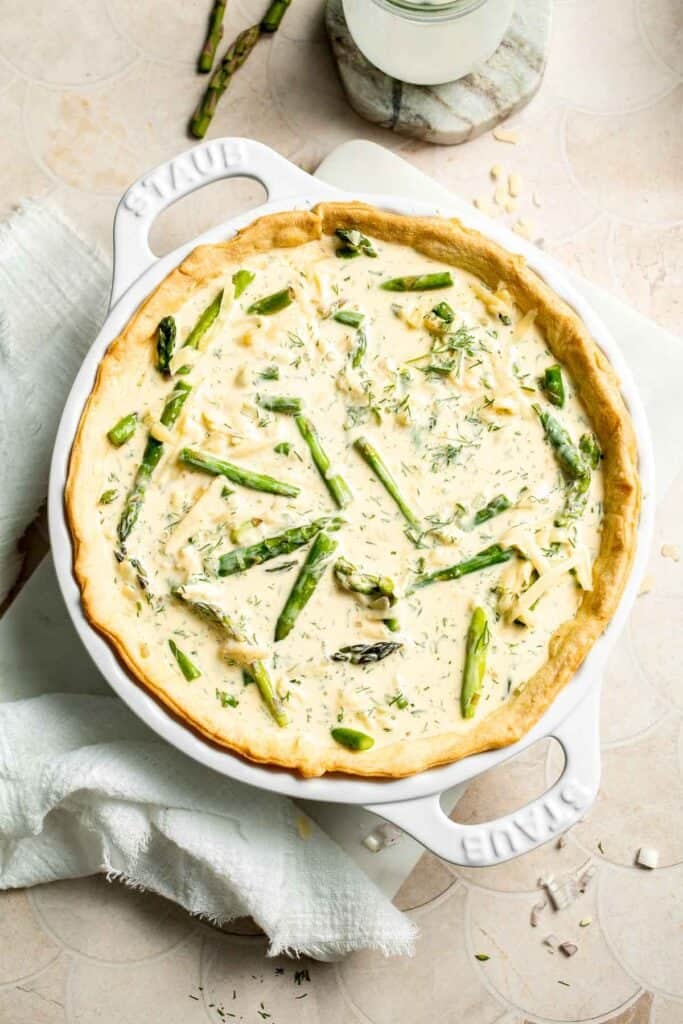 Creamy asparagus quiche with Gruyère cheese, flaky crust, and fresh dill, perfect for spring brunch, meal prep, or light dinner. | aheadofthyme.com