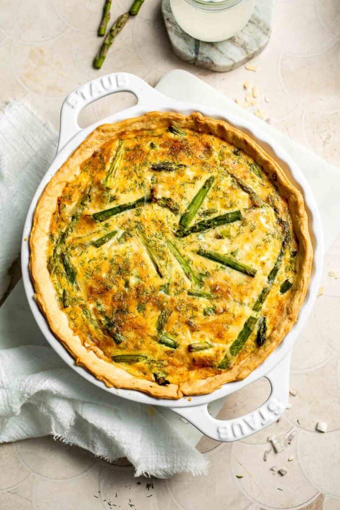 Creamy asparagus quiche with Gruyère cheese, flaky crust, and fresh dill, perfect for spring brunch, meal prep, or light dinner. | aheadofthyme.com