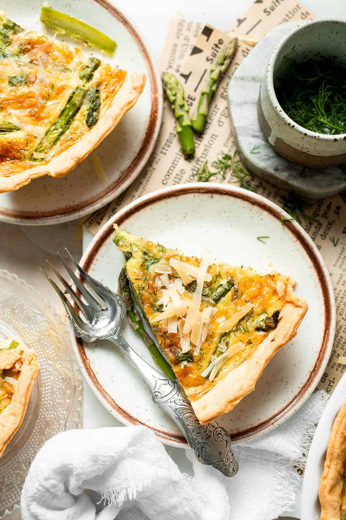 Creamy asparagus quiche with Gruyère cheese, flaky crust, and fresh dill, perfect for spring brunch, meal prep, or light dinner. | aheadofthyme.com