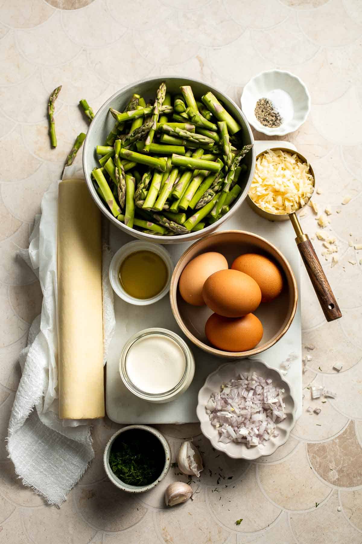 Creamy asparagus quiche with Gruyère cheese, flaky crust, and fresh dill, perfect for spring brunch, meal prep, or light dinner. | aheadofthyme.com