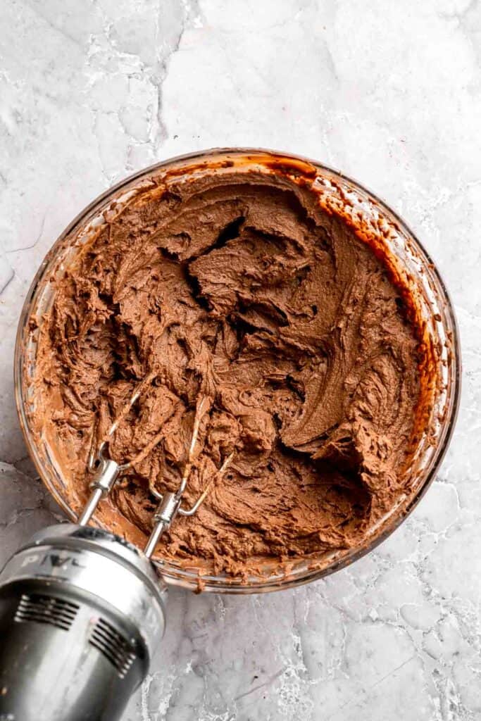 Chocolate mousse cake with rich layers, fluffy mousse, and glossy ganache. Easy, decadent dessert perfect for celebrations and chocolate lovers. | aheadofthyme.com