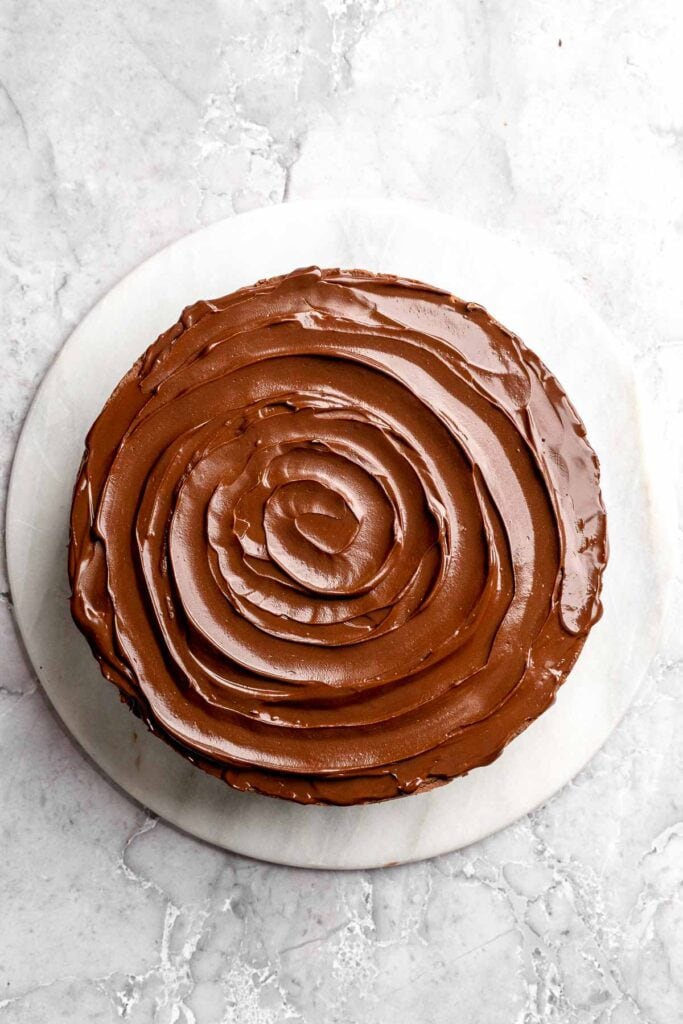 Chocolate mousse cake with rich layers, fluffy mousse, and glossy ganache. Easy, decadent dessert perfect for celebrations and chocolate lovers. | aheadofthyme.com