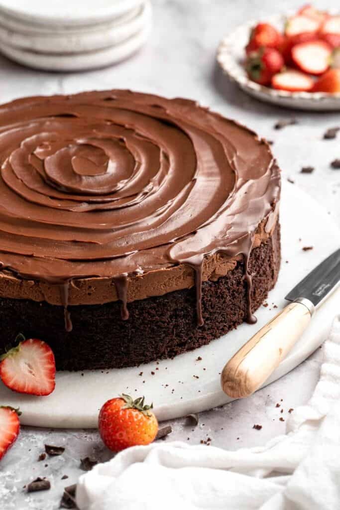 Chocolate mousse cake with rich layers, fluffy mousse, and glossy ganache. Easy, decadent dessert perfect for celebrations and chocolate lovers. | aheadofthyme.com