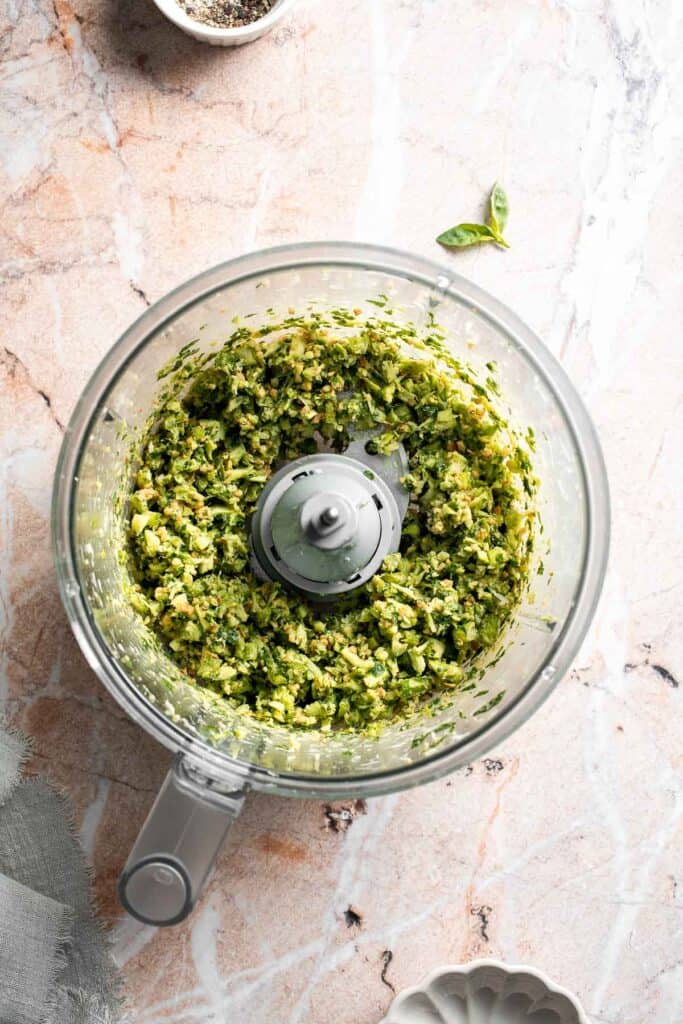 Fresh garlic scape pesto with basil, parmesan, toasted walnuts, and olive oil. Easy seasonal summer sauce for pasta, sandwiches, and more. | aheadofthyme.com