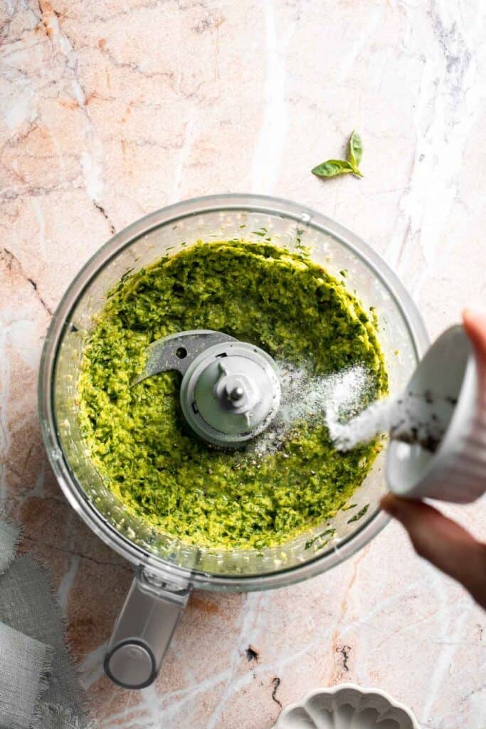 Fresh garlic scape pesto with basil, parmesan, toasted walnuts, and olive oil. Easy seasonal summer sauce for pasta, sandwiches, and more. | aheadofthyme.com