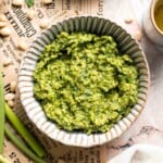 Fresh garlic scape pesto with basil, parmesan, toasted walnuts, and olive oil. Easy seasonal summer sauce for pasta, sandwiches, and more. | aheadofthyme.com