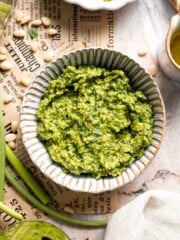 Fresh garlic scape pesto with basil, parmesan, toasted walnuts, and olive oil. Easy seasonal summer sauce for pasta, sandwiches, and more. | aheadofthyme.com