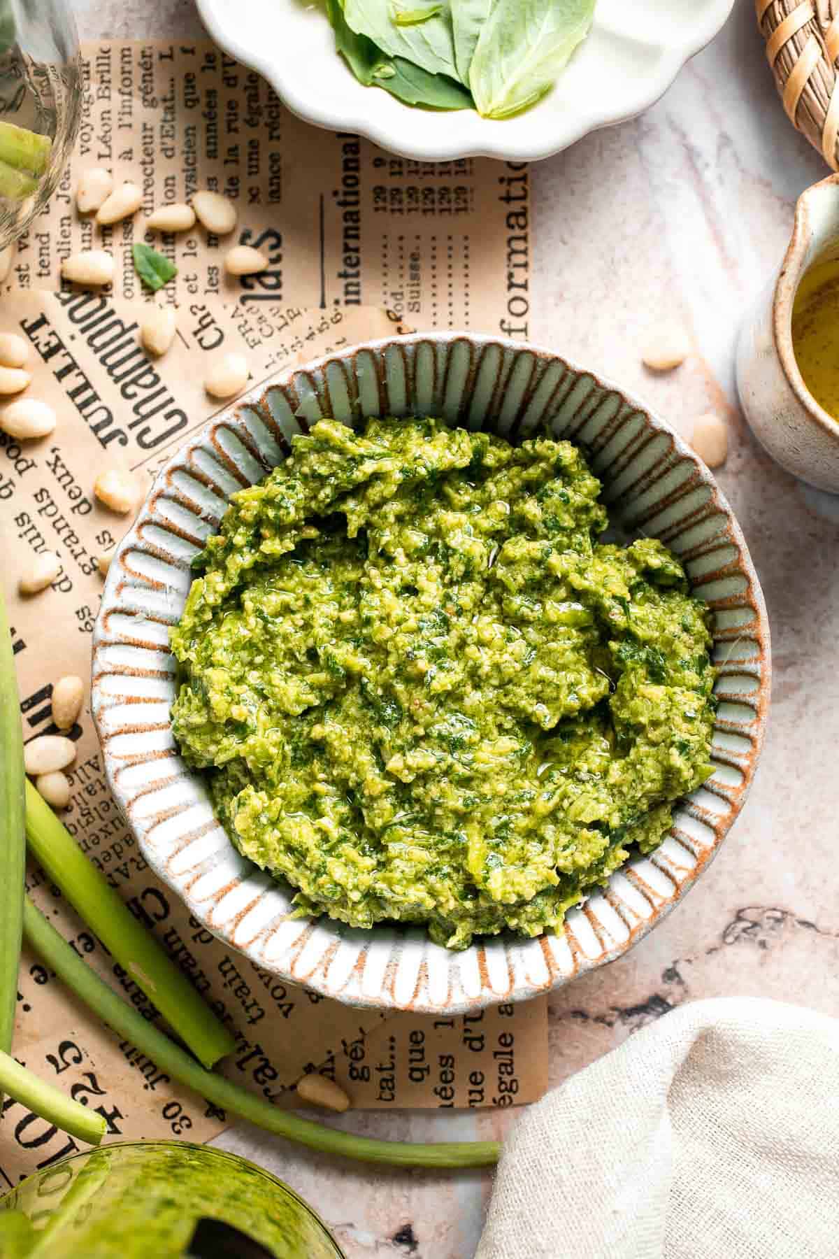 Fresh garlic scape pesto with basil, parmesan, toasted walnuts, and olive oil. Easy seasonal summer sauce for pasta, sandwiches, and more. | aheadofthyme.com