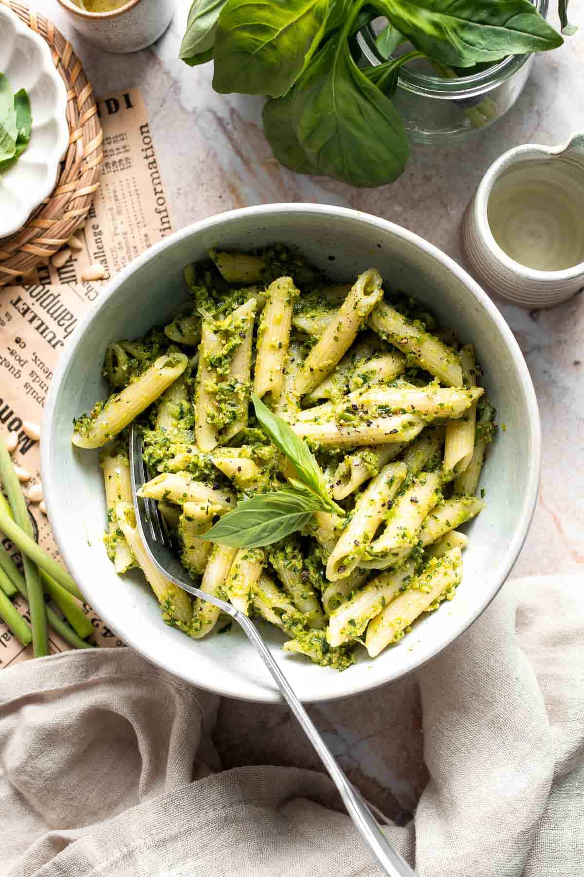Fresh garlic scape pesto with basil, parmesan, toasted walnuts, and olive oil. Easy seasonal summer sauce for pasta, sandwiches, and more. | aheadofthyme.com
