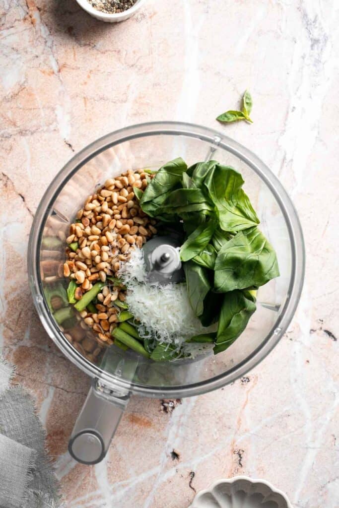Fresh garlic scape pesto with basil, parmesan, toasted walnuts, and olive oil. Easy seasonal summer sauce for pasta, sandwiches, and more. | aheadofthyme.com