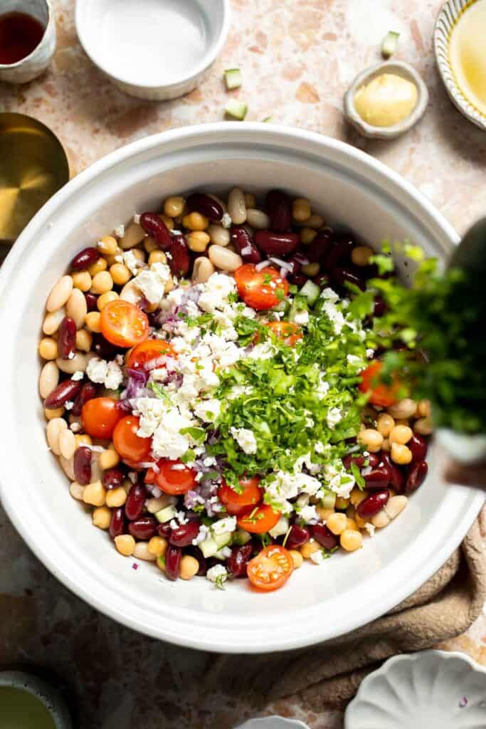 Mediterranean dense bean salad packed with chickpeas, vegetables, feta, and lemon dressing. Healthy meal prep salad full of fresh flavor. | aheadofthyme.com
