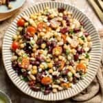 Mediterranean dense bean salad packed with chickpeas, vegetables, feta, and lemon dressing. Healthy meal prep salad full of fresh flavor. | aheadofthyme.com
