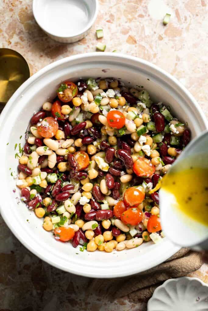 Mediterranean dense bean salad packed with chickpeas, vegetables, feta, and lemon dressing. Healthy meal prep salad full of fresh flavor. | aheadofthyme.com