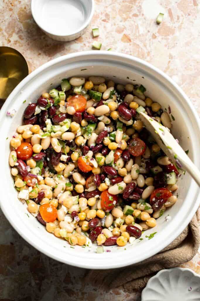 Mediterranean dense bean salad packed with chickpeas, vegetables, feta, and lemon dressing. Healthy meal prep salad full of fresh flavor. | aheadofthyme.com