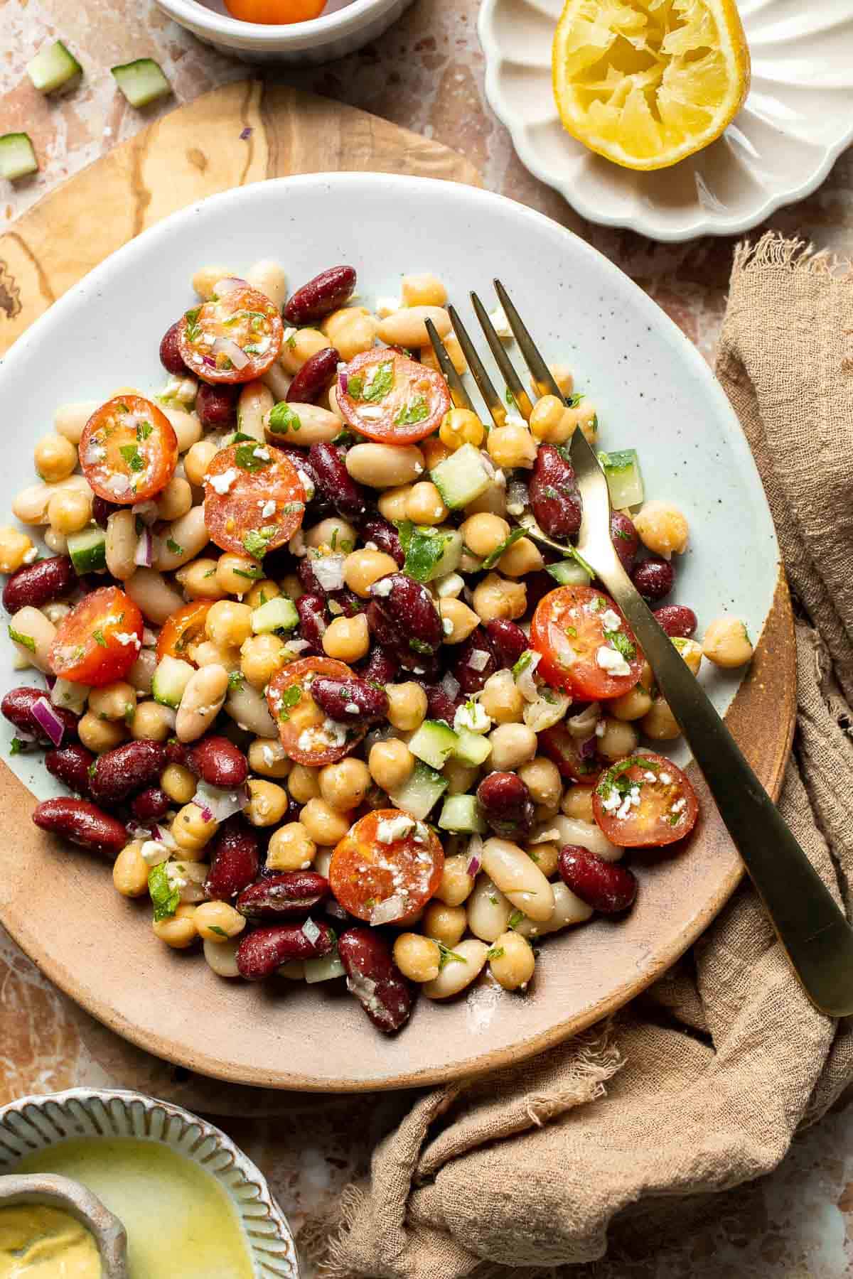 Mediterranean dense bean salad packed with chickpeas, vegetables, feta, and lemon dressing. Healthy meal prep salad full of fresh flavor. | aheadofthyme.com