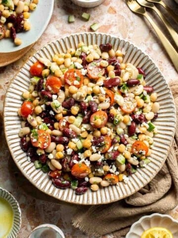 Mediterranean dense bean salad packed with chickpeas, vegetables, feta, and lemon dressing. Healthy meal prep salad full of fresh flavor. | aheadofthyme.com