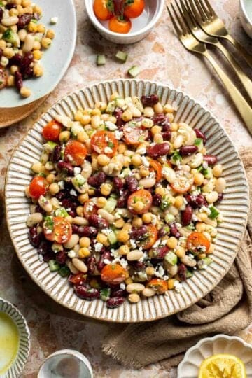 Mediterranean dense bean salad packed with chickpeas, vegetables, feta, and lemon dressing. Healthy meal prep salad full of fresh flavor. | aheadofthyme.com