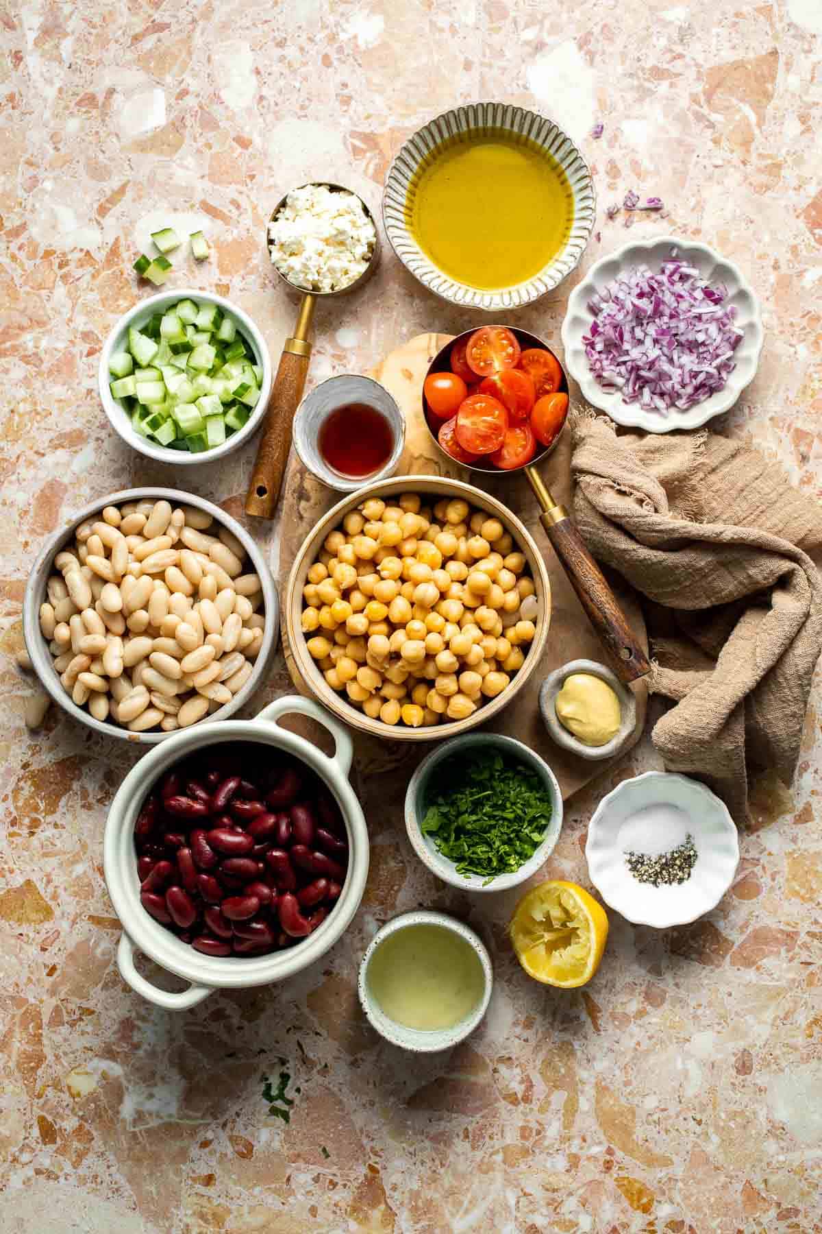 Mediterranean dense bean salad packed with chickpeas, vegetables, feta, and lemon dressing. Healthy meal prep salad full of fresh flavor. | aheadofthyme.com