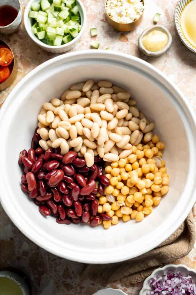 Mediterranean dense bean salad packed with chickpeas, vegetables, feta, and lemon dressing. Healthy meal prep salad full of fresh flavor. | aheadofthyme.com