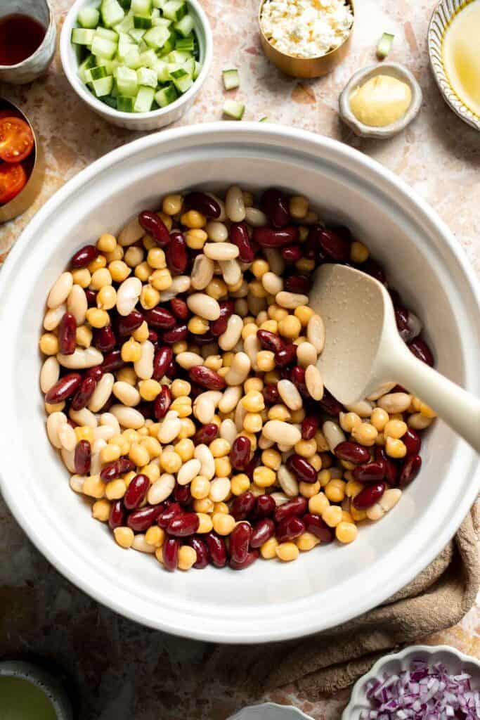 Mediterranean dense bean salad packed with chickpeas, vegetables, feta, and lemon dressing. Healthy meal prep salad full of fresh flavor. | aheadofthyme.com