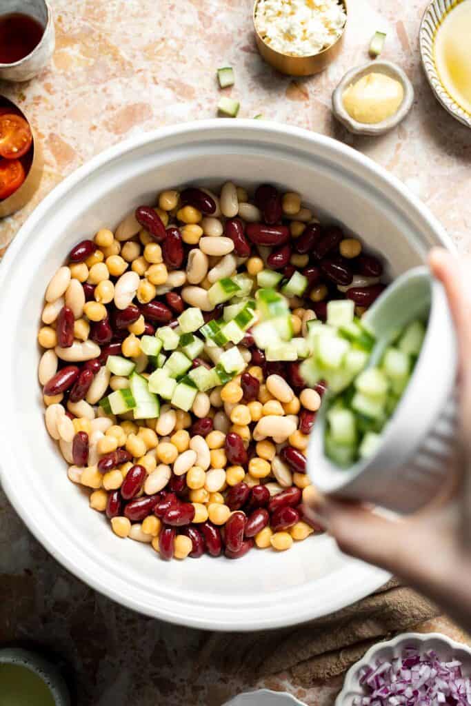 Mediterranean dense bean salad packed with chickpeas, vegetables, feta, and lemon dressing. Healthy meal prep salad full of fresh flavor. | aheadofthyme.com