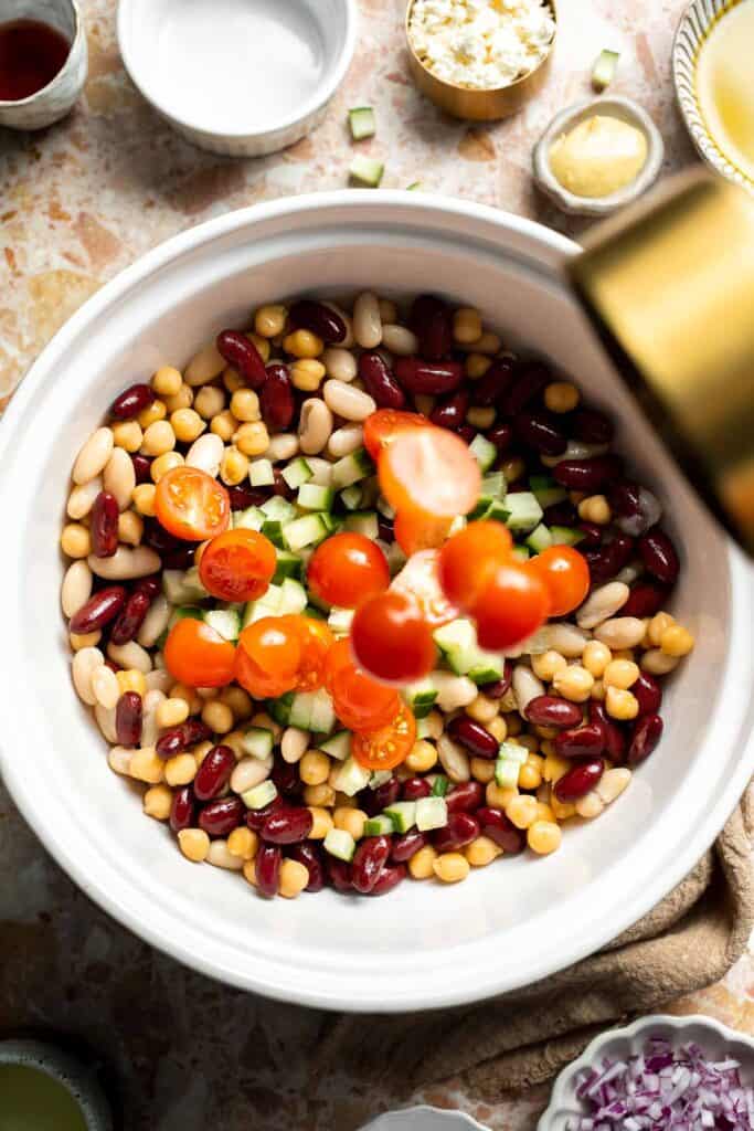 Mediterranean dense bean salad packed with chickpeas, vegetables, feta, and lemon dressing. Healthy meal prep salad full of fresh flavor. | aheadofthyme.com